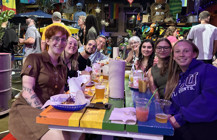 students and PIs sitting at table